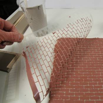 Remove stencil to reveal dolls house brick wall effect